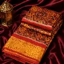 Rust Orange Patola Print Saree with Golden Zari Border