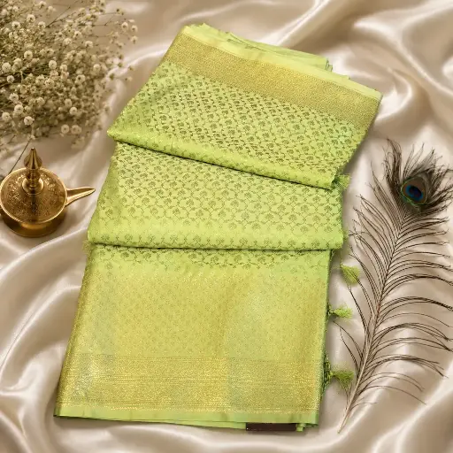 [74209001HG34B9] Elegant Mint Green Banarasi Silk Saree with Woven Zari Border & Tassels